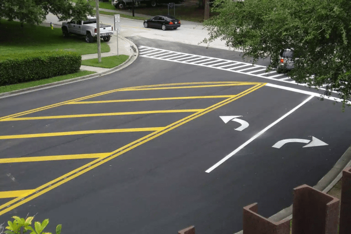 You see red raised roadway markers in the road ahead.